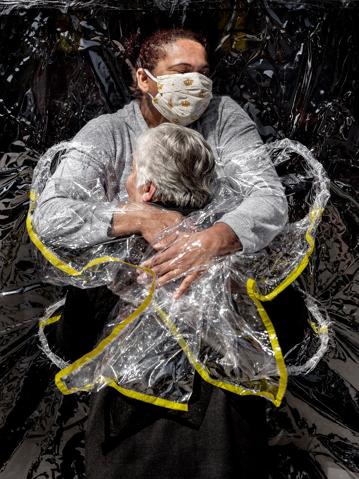 World Press Photo of the Year Nominee, Mads Nissen, Denmark, Politiken/Panos Pictures, The First Embrace. Rosa Luzia Lunardi (85) is embraced by nurse Adriana Silva da Costa Souza, at Viva Bem care home, S&atilde;o Paulo, Brazil, on 5 August.